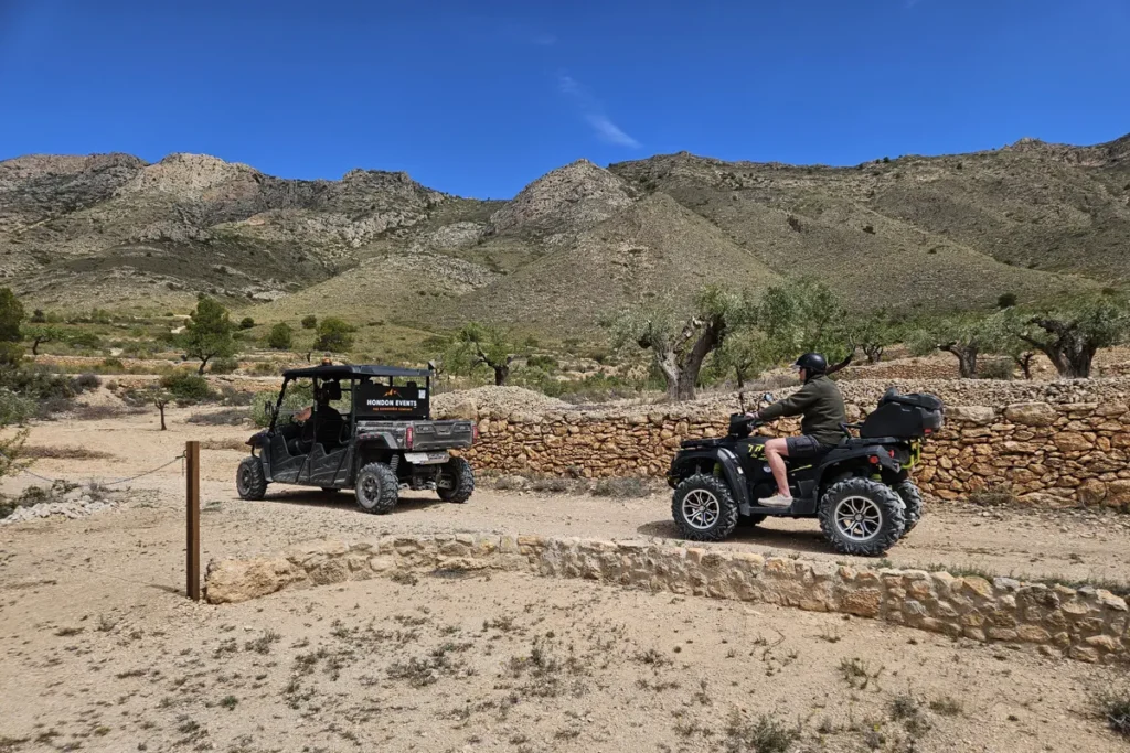 Two quad drivers are enjoying stunning scenery.